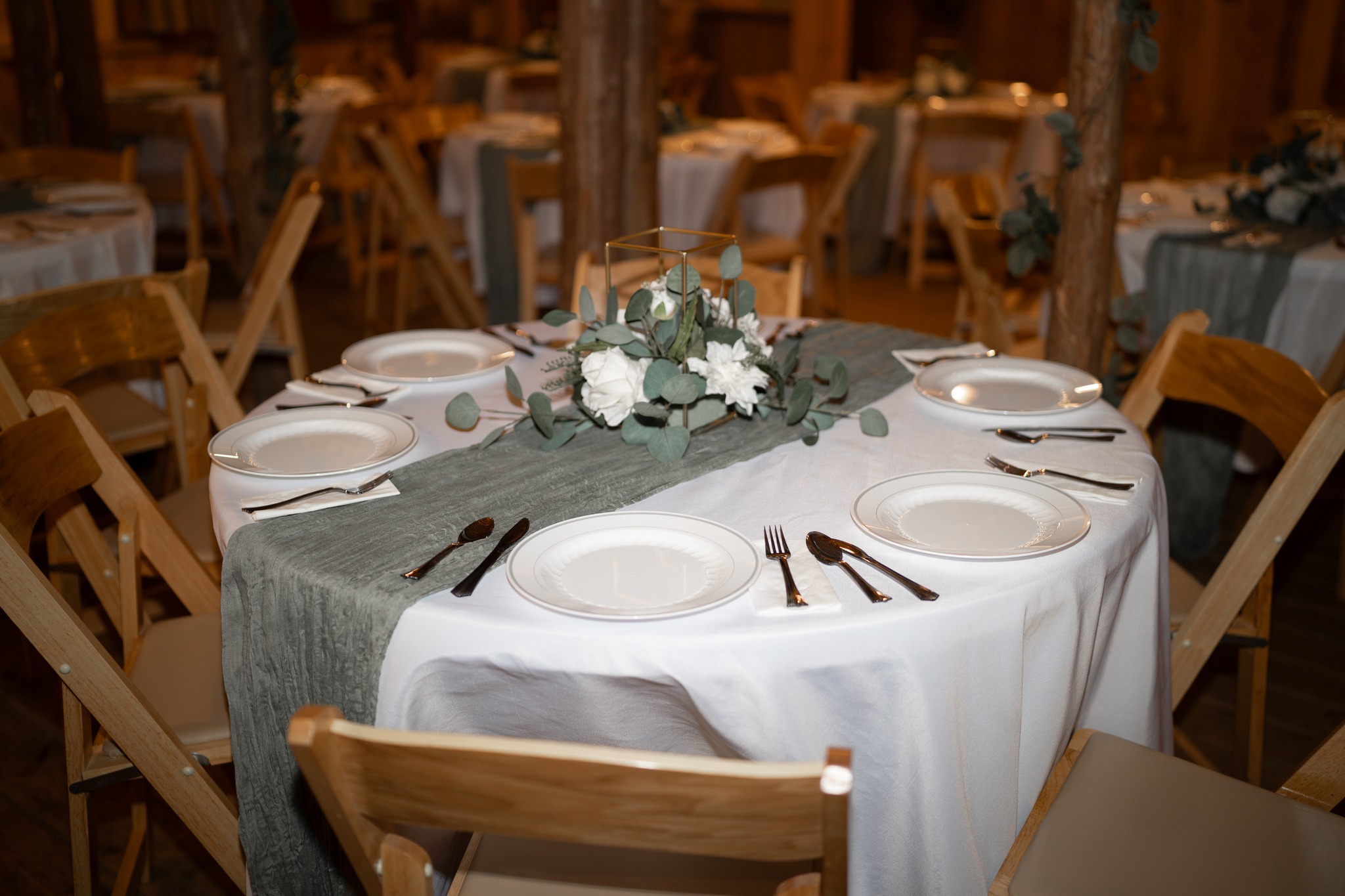 All Inclusive Wedding Reception Package Pigeon Forge (12) reception table set up with white table cloth and green table runner