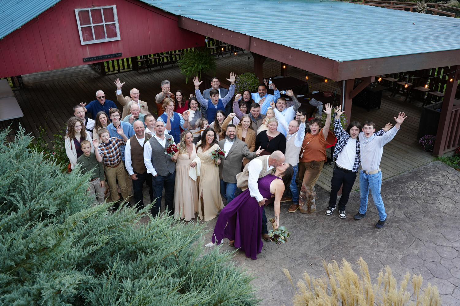 All Inclusive Wedding Reception Package Pigeon Forge (17) Wedding guests shouting in congratulations at the creekside pavilion at Honeysuckle Hills in Pigeon Forge
