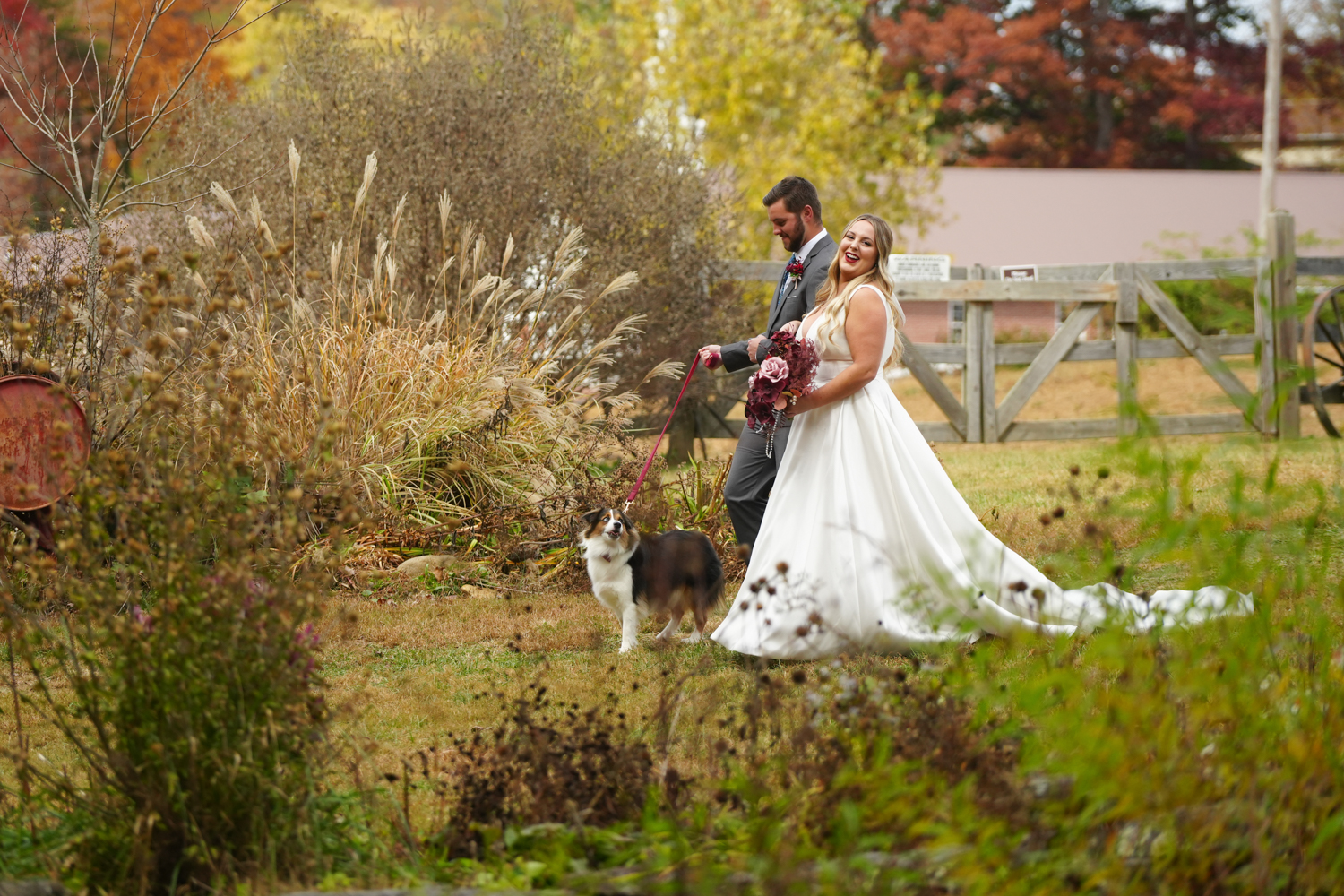 smiling bride escorted to her wedding ceremony in the gardens at Honeysuckle Hills in Pigeon Forge